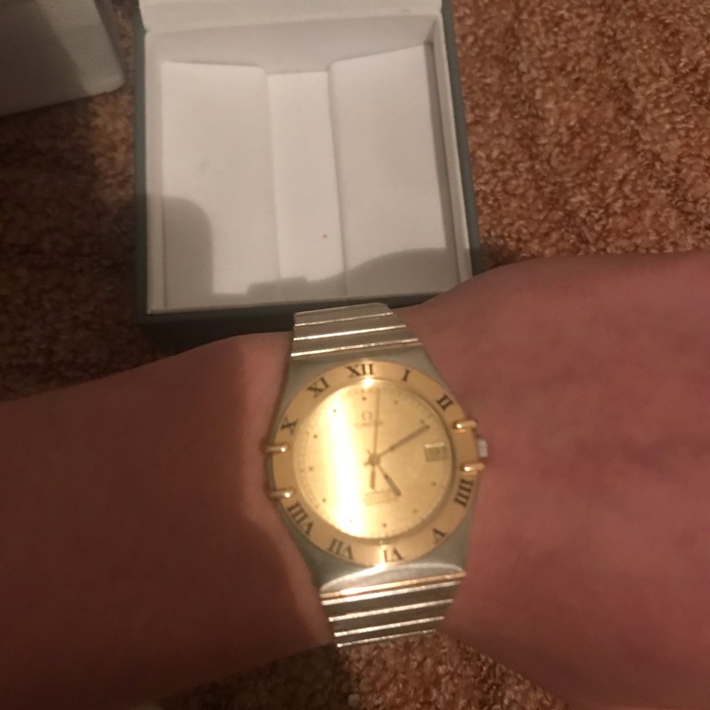 Omega gold watch.